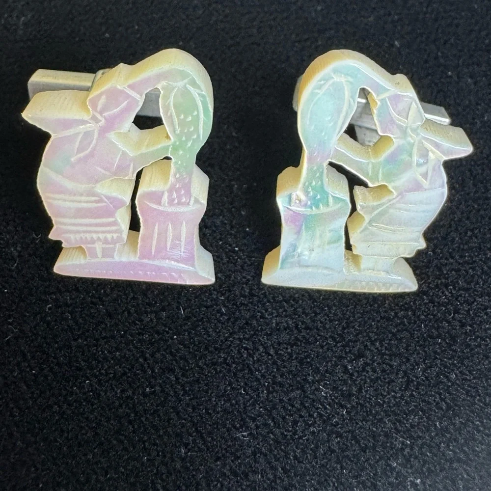 Vintage men’s carved mother of pearl cufflinks of women pouring grain